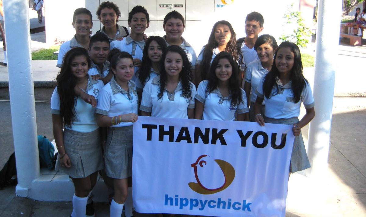 children holding thank you sign