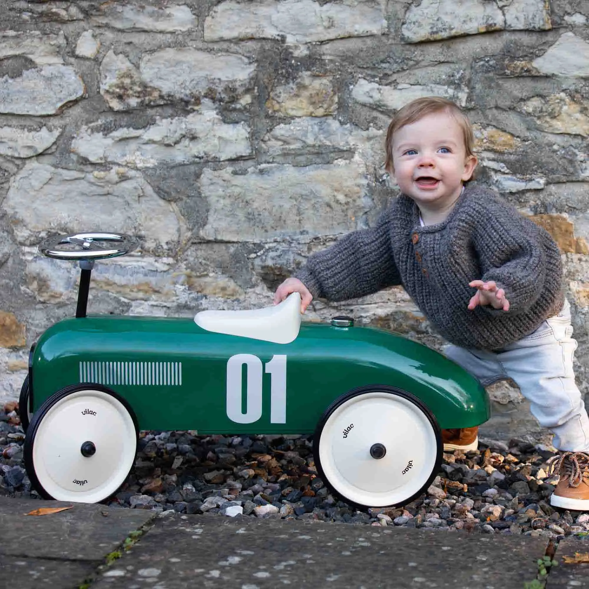 Boy standing behind the Vilac Racing Green Car