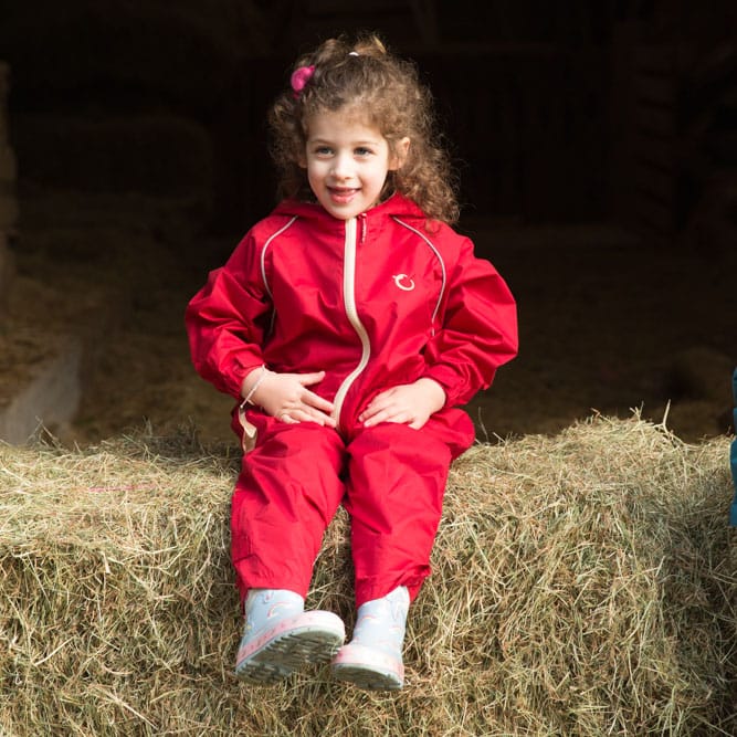 hippychick-400 RESIZED Girl sitting on hay bale wearing a Fiesta Red Shell Suit