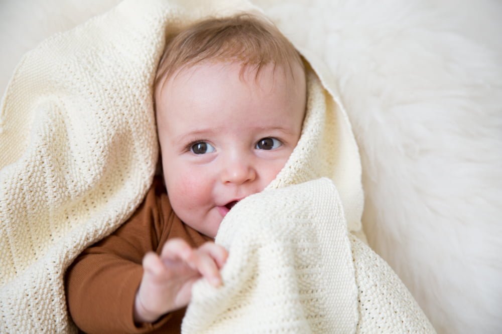 baby wrapped in cellular blanket