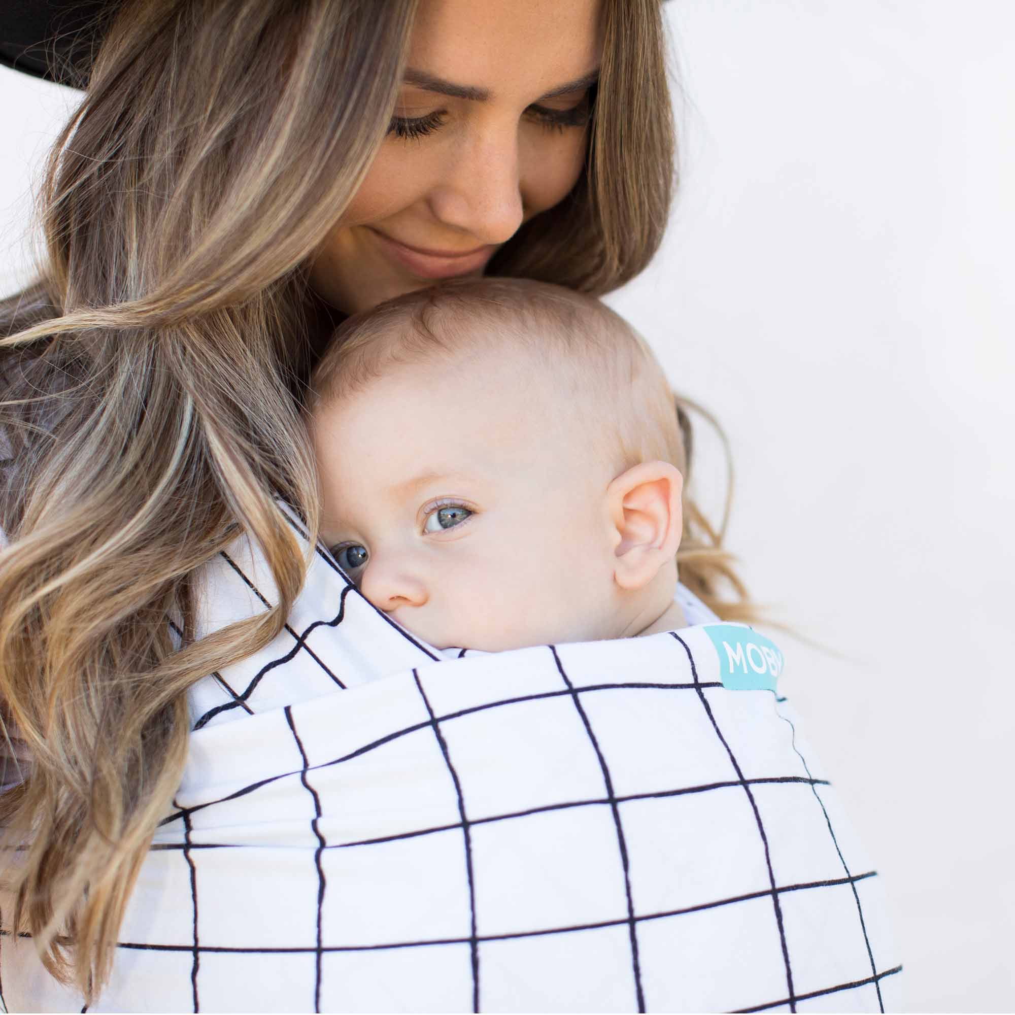Close up of mother carrying baby in Lattice Evolution Wrap