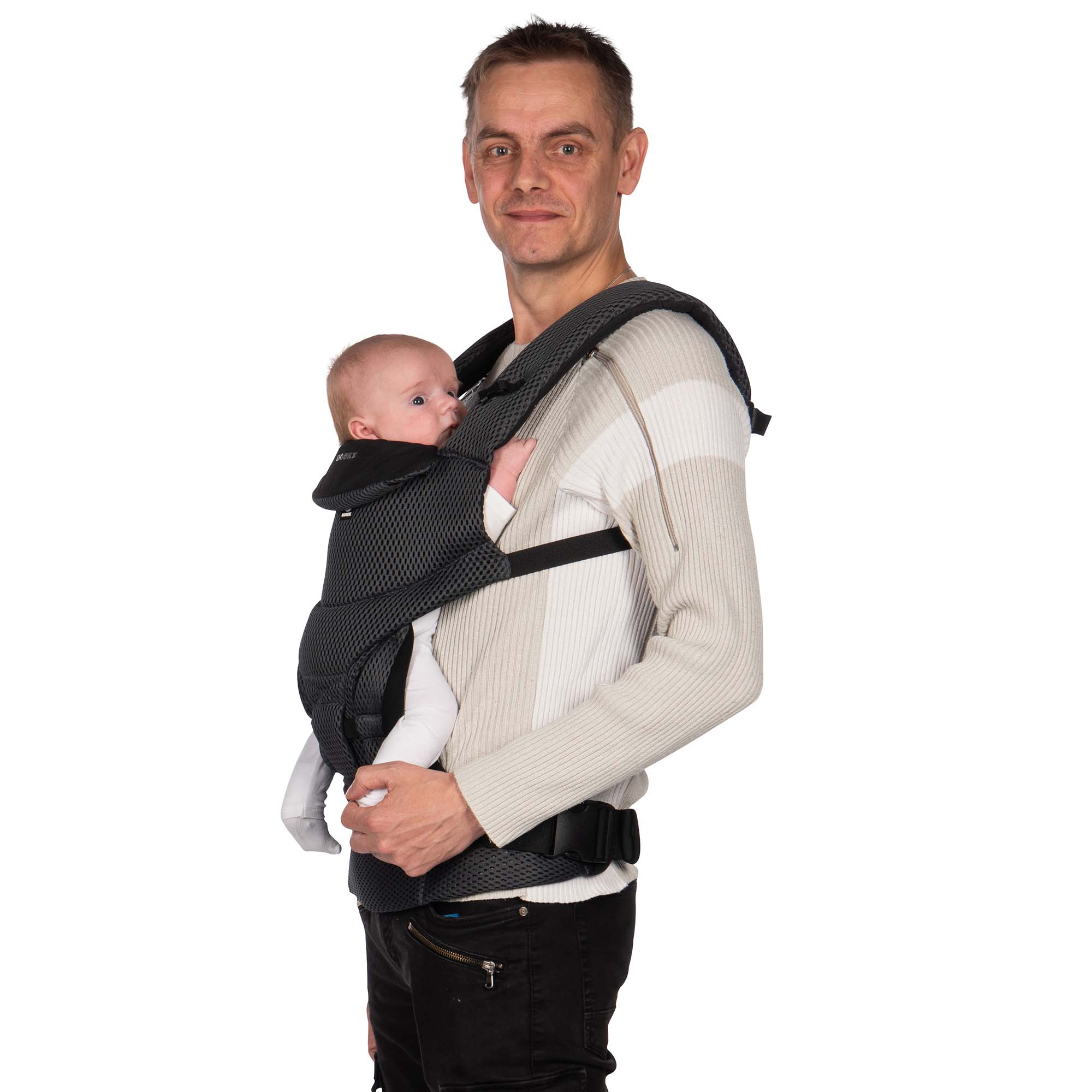 Dad holding baby in the Dooky Urban Comfort Carrier