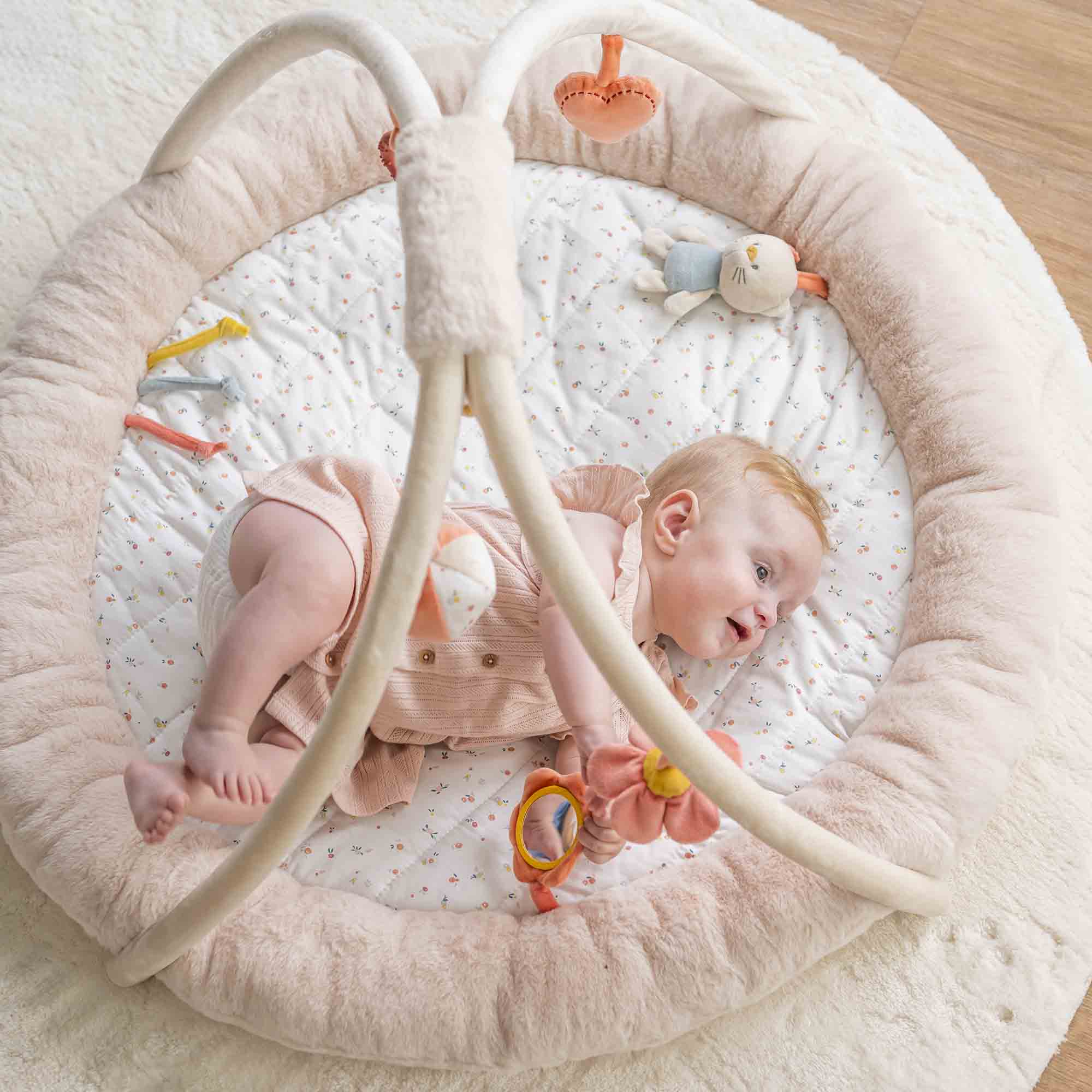 Birdseye view of a baby playing with the playmat