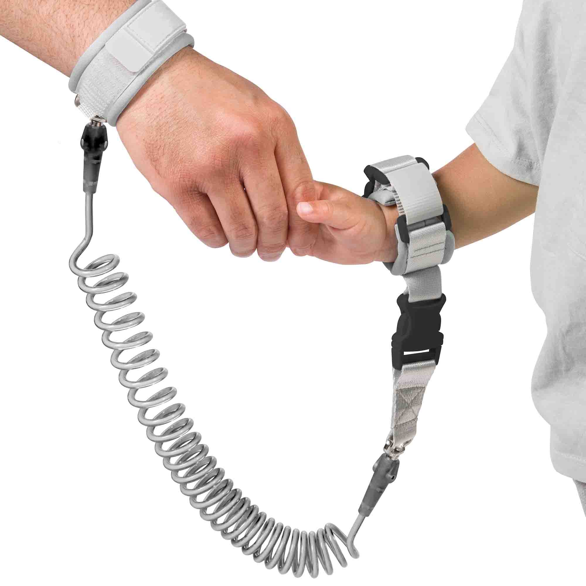 Child and parent holding hand with the Dooky Safety Wristband
