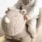 Child sitting on the Rhino Teddy Rocker, close up of rhino's face