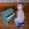 Little boy playing the Vintage piano