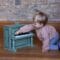 Little boy playing the Vintage piano