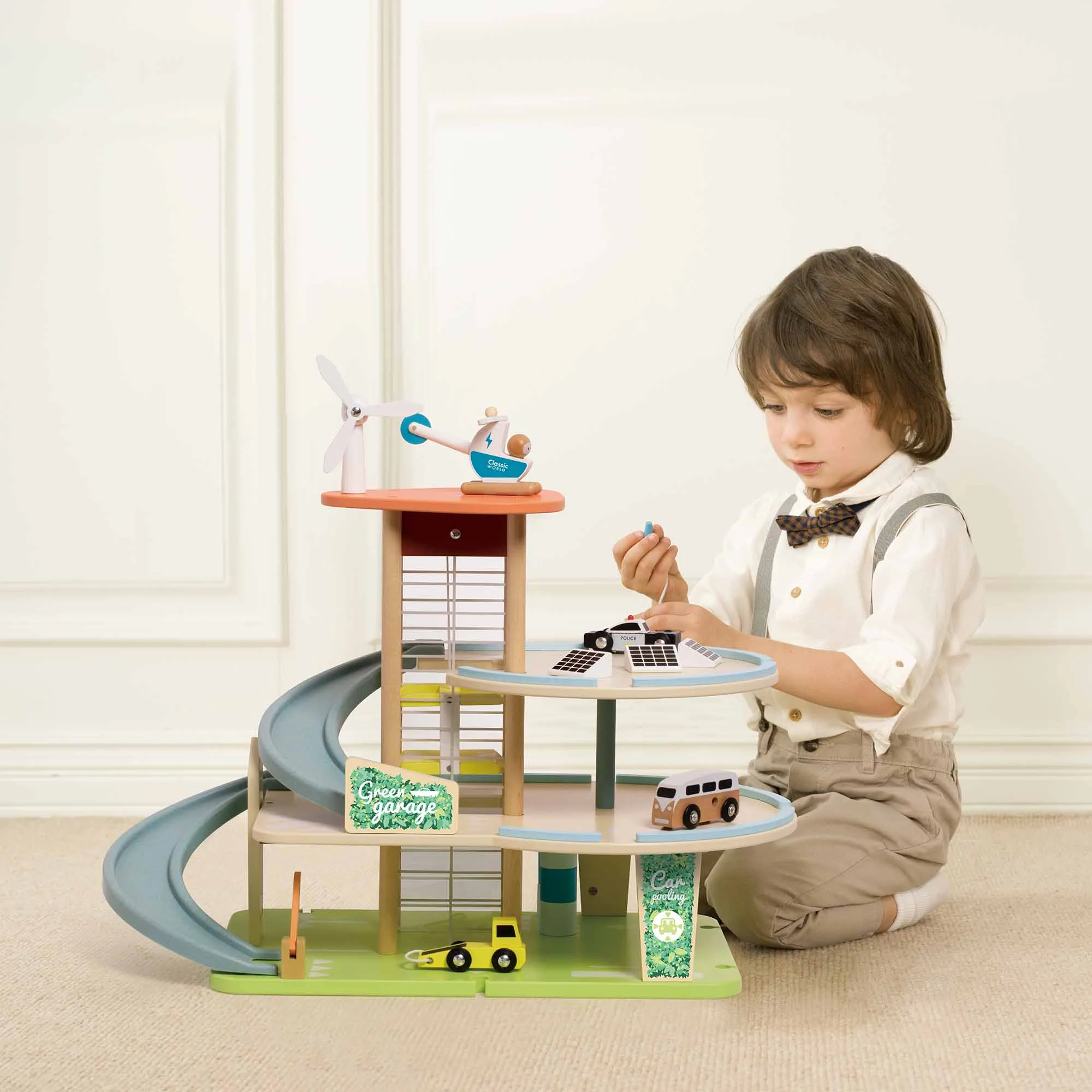Child playing with Close up of Classic World Green Garage Car Wash