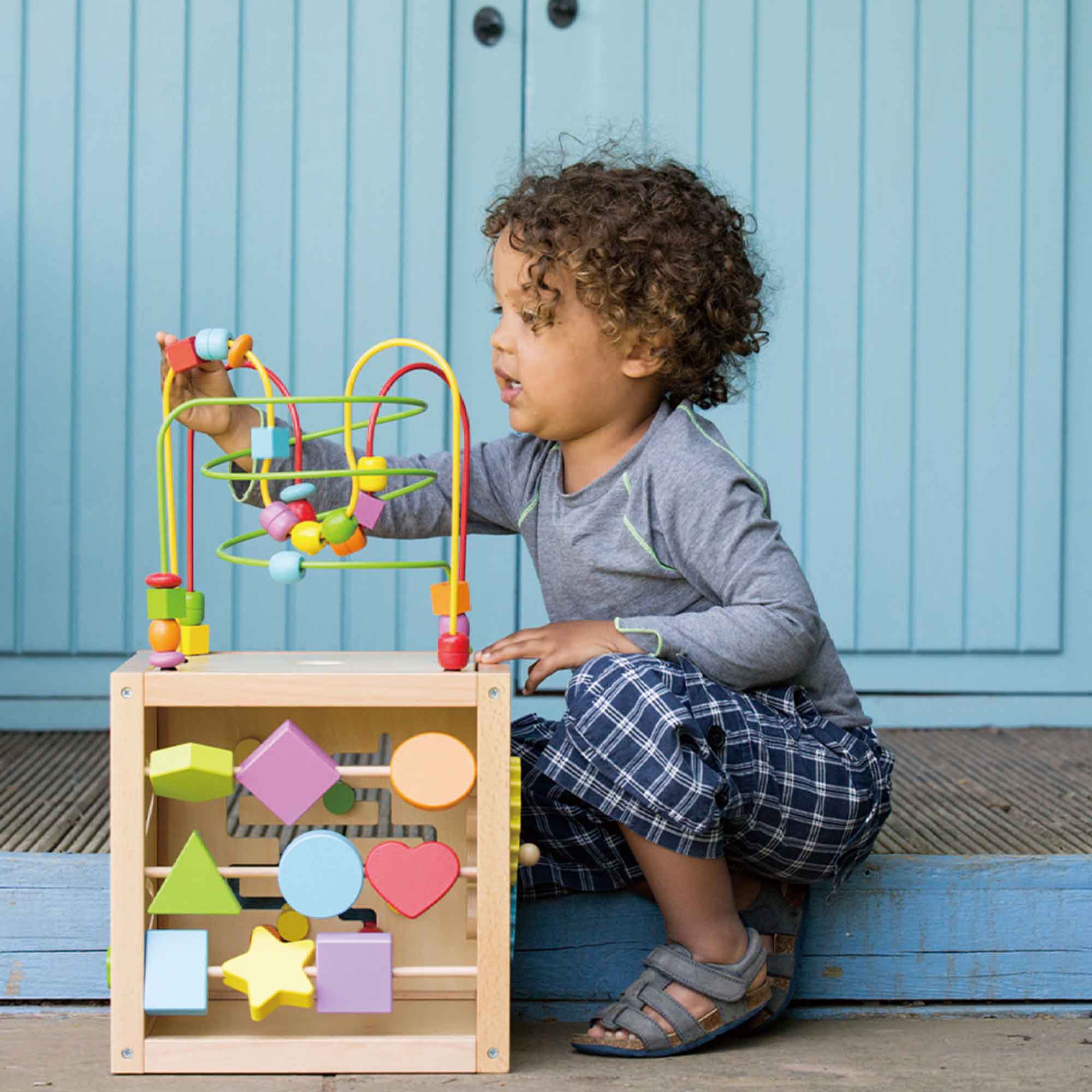 Child playing with the Multi Activity Cube