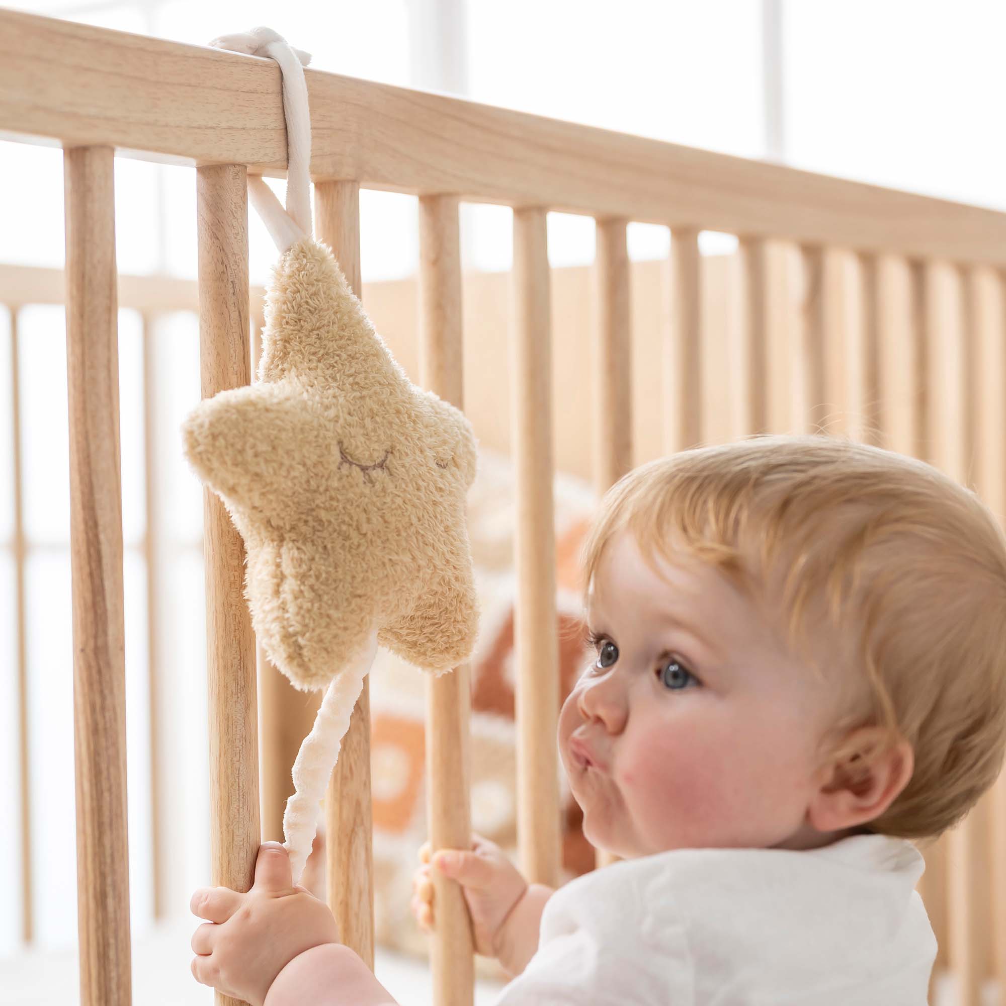 Star Musical Toy on Cot