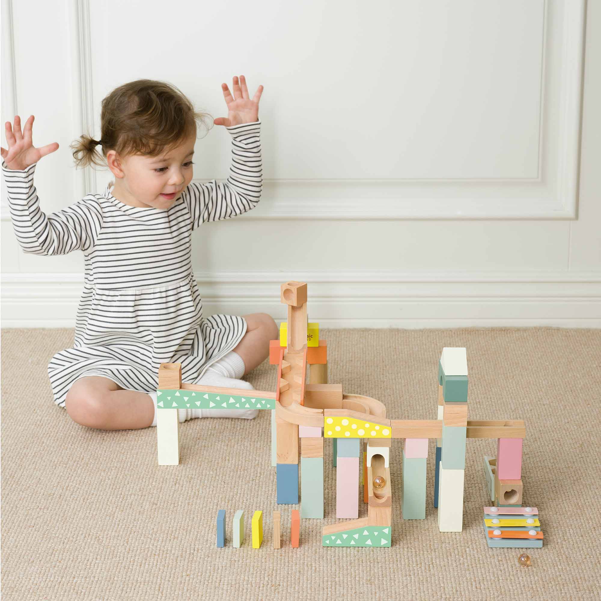 Child playing with Marble Blocks