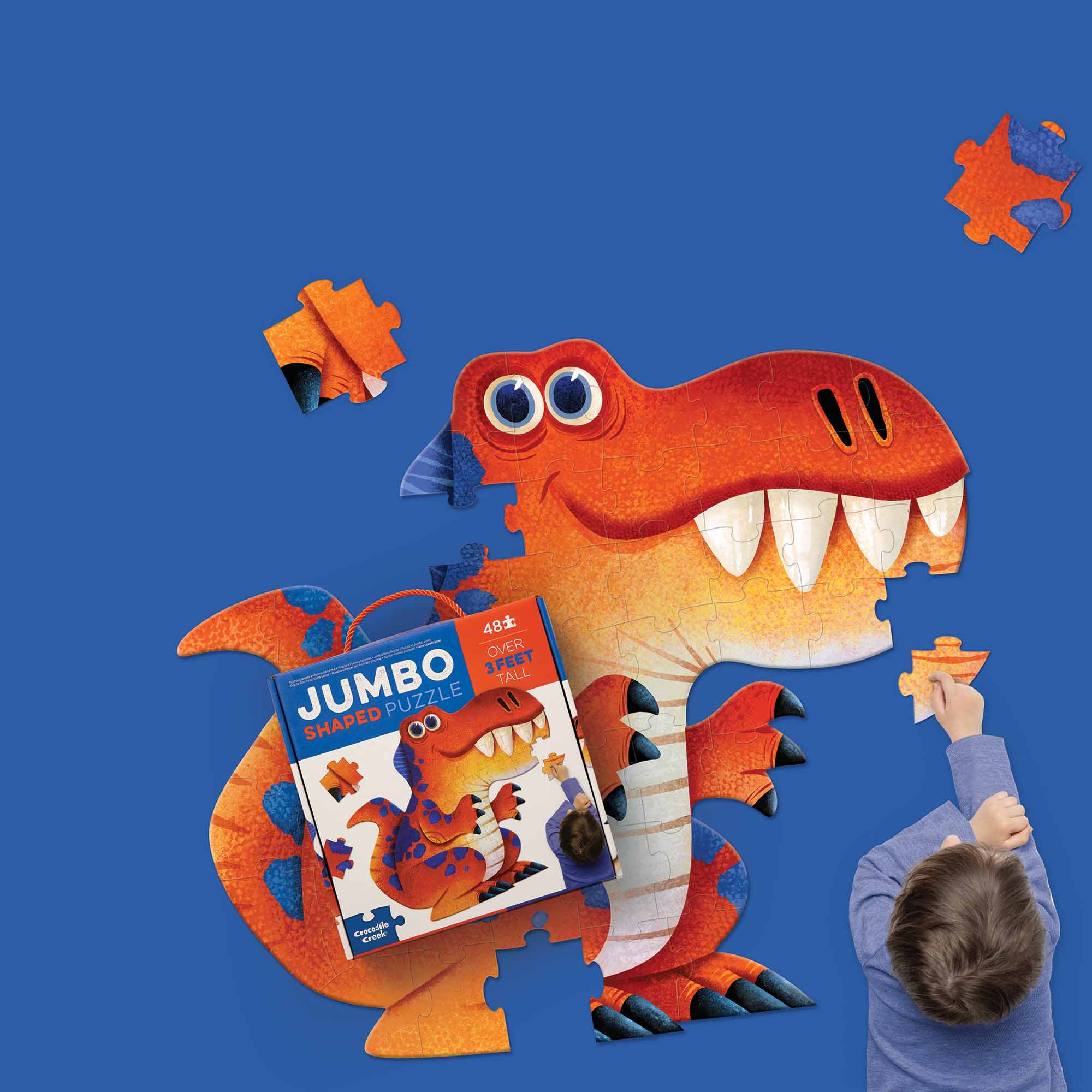 Child playing with the Jumbo Dinosaur Puzzle