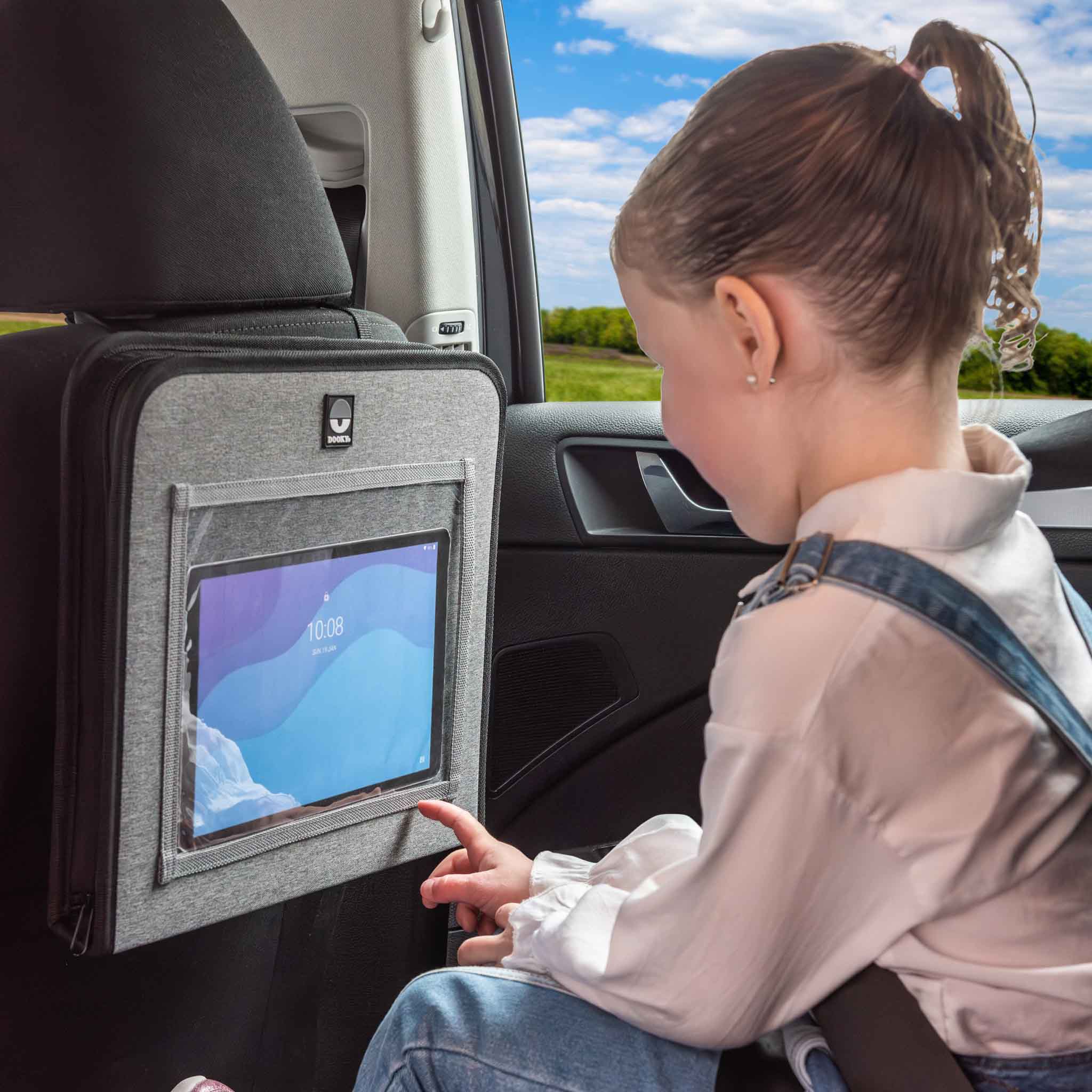 Girl using the Back Seat Travel Tray