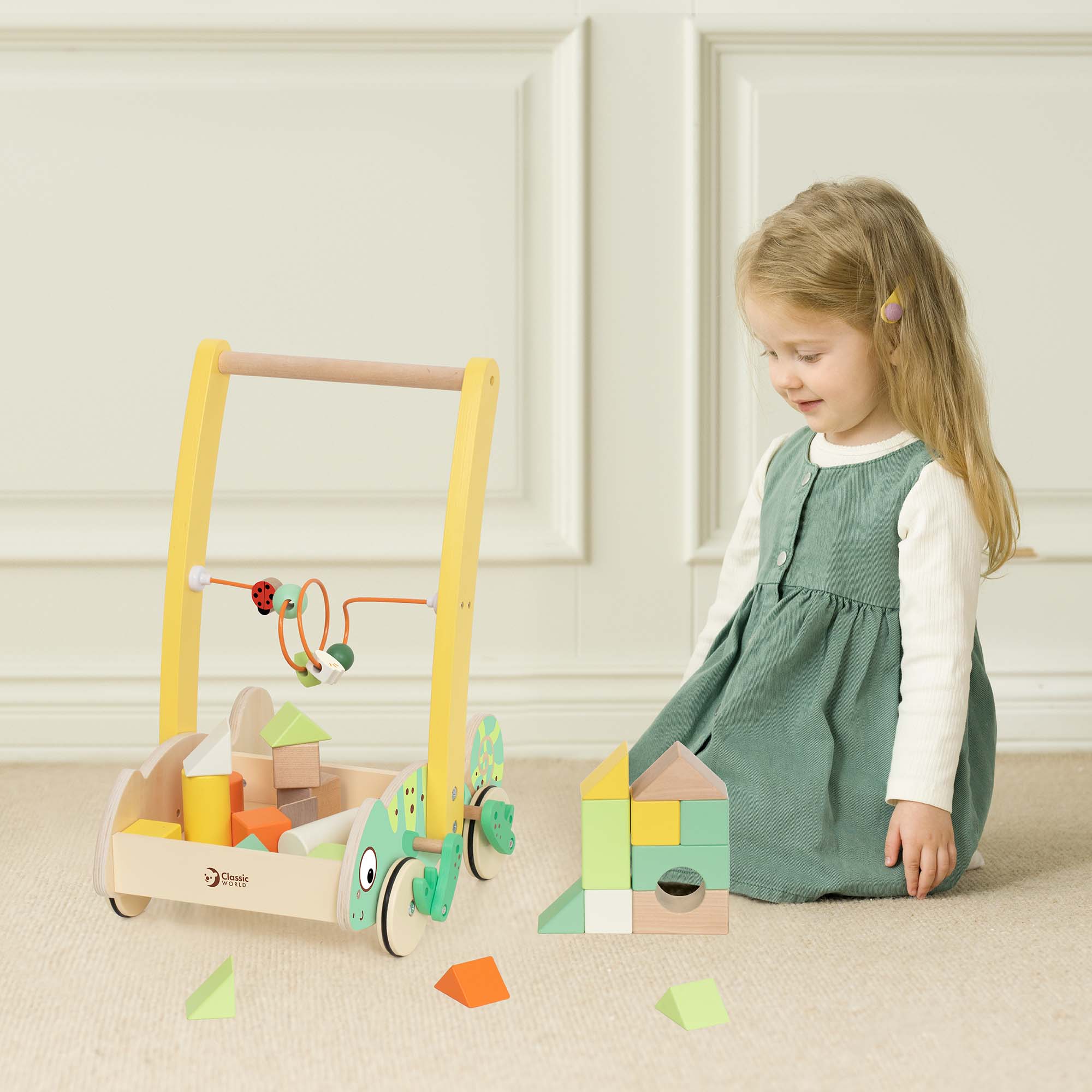 Girl playing with the Classic World Chameleon Baby Walker With Blocks