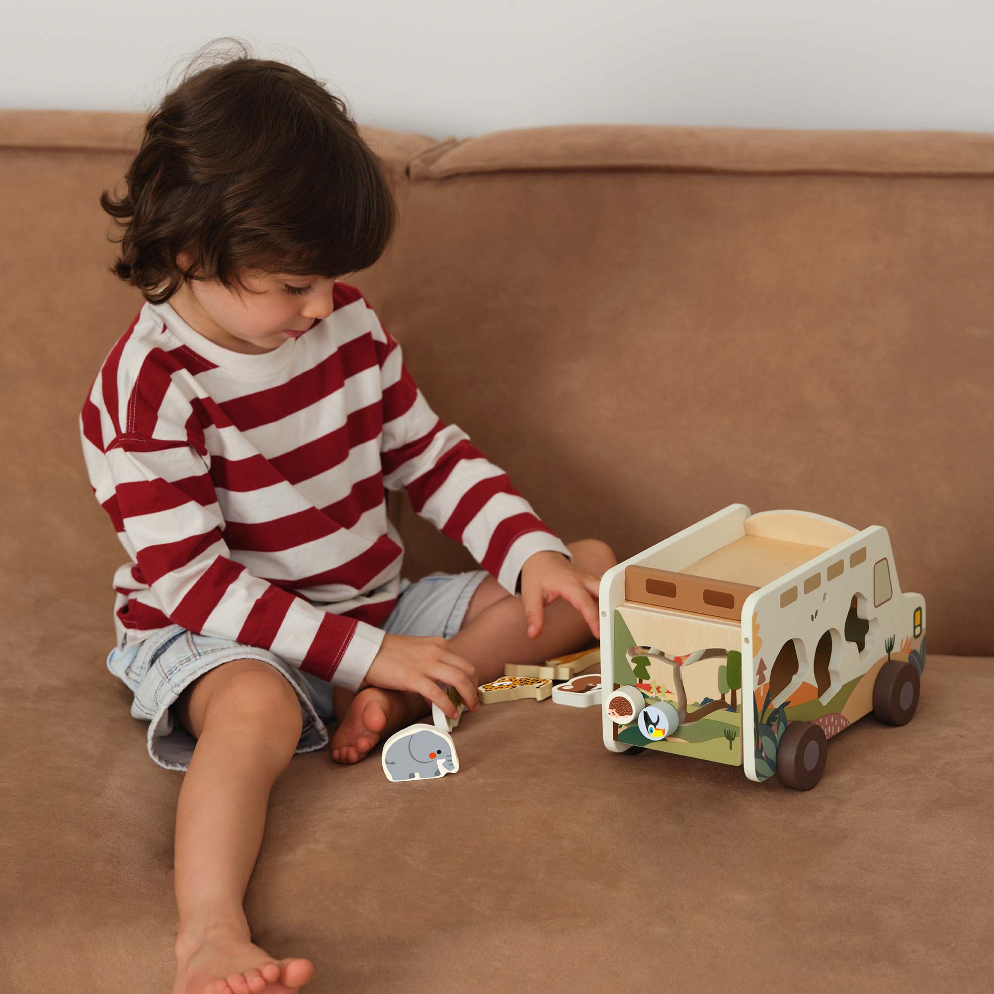 Child playing with the Classic World Prairie Adventurer Truck