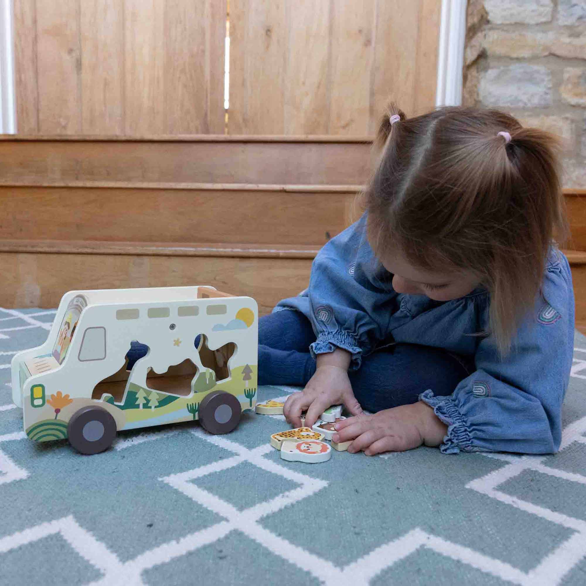 Little girl playing with the Prairie Adventurer Truck