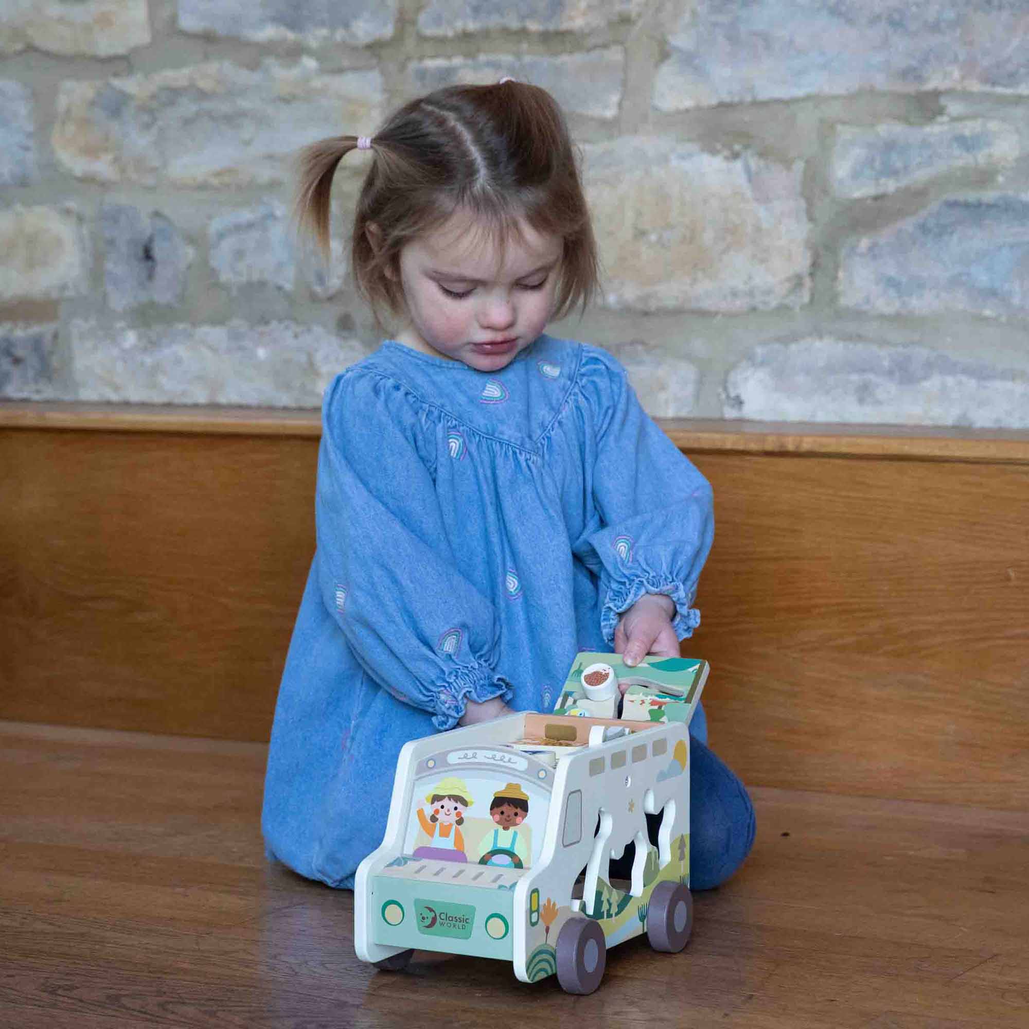 Little girl playing with the Prairie Adventurer Truck