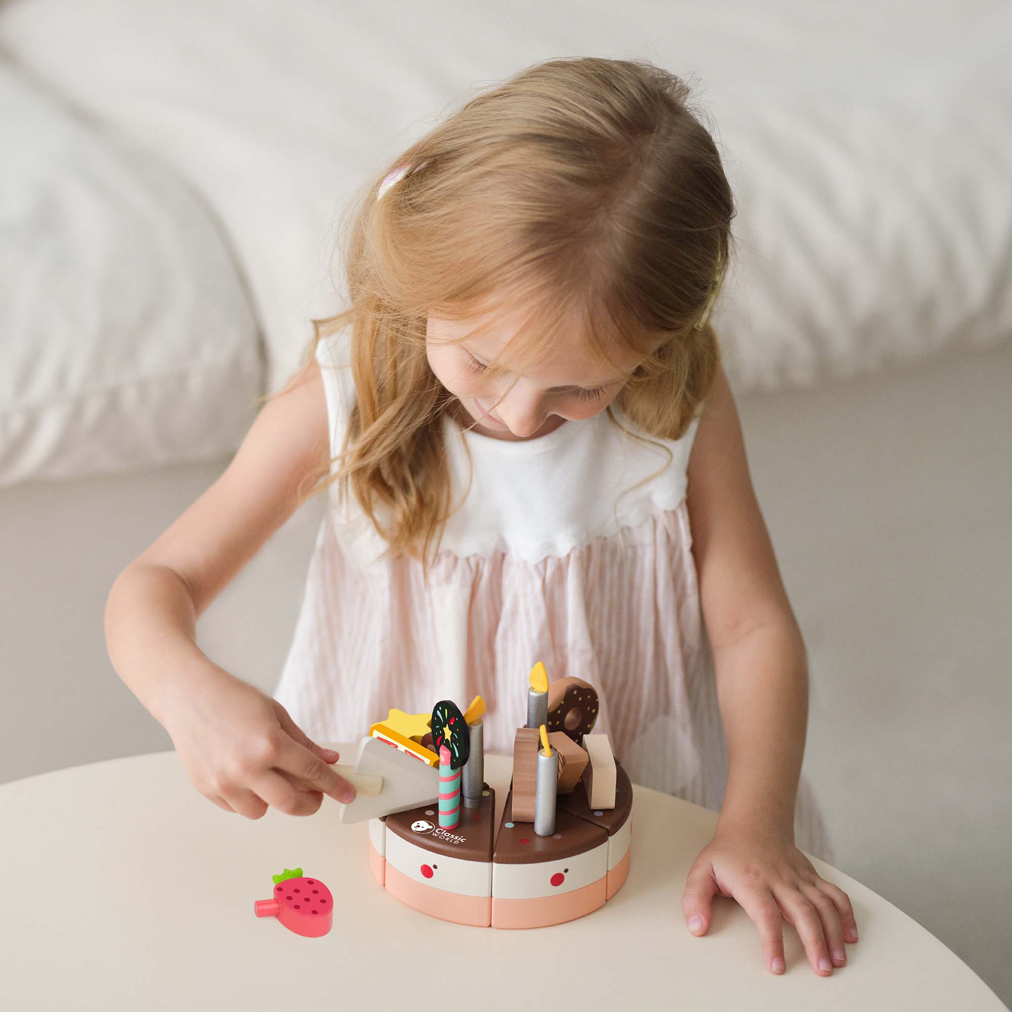 Girl playing with the Classic World Chocolate Cake