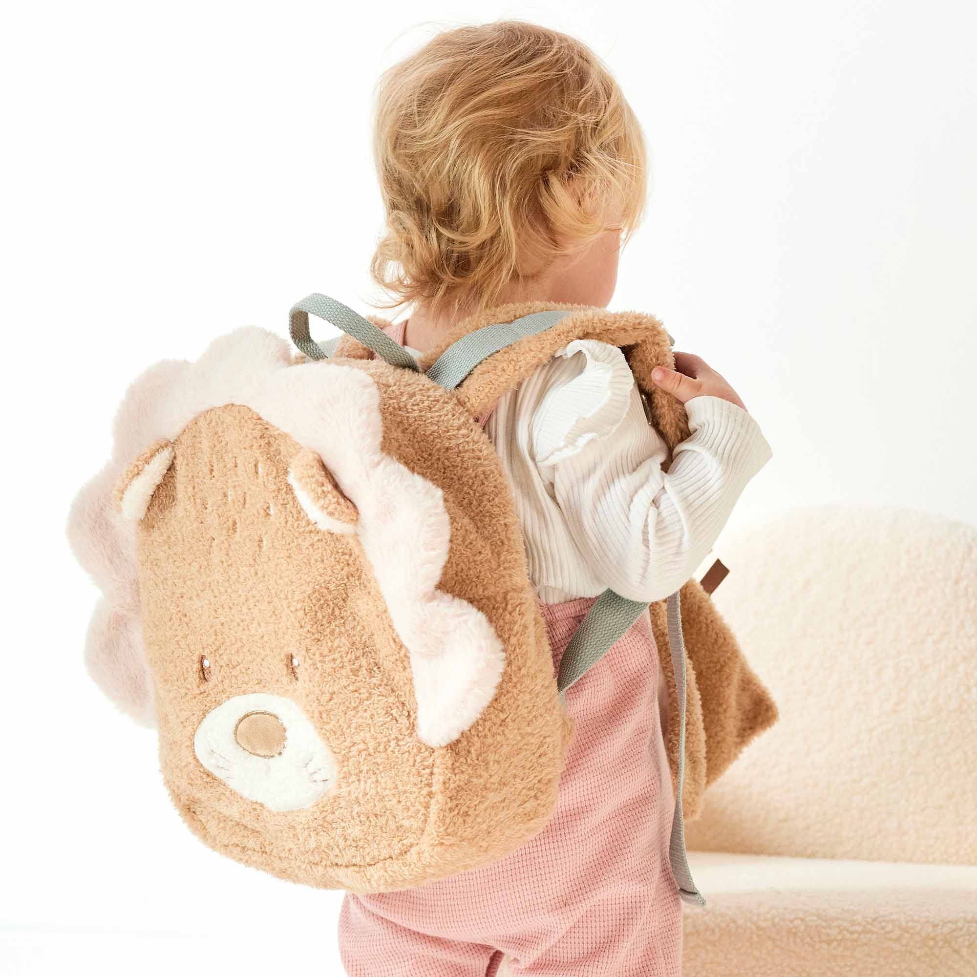 Girl with Lion Teddy Backpack on her back