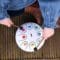 Little girls hands playing with the Tongue Drum