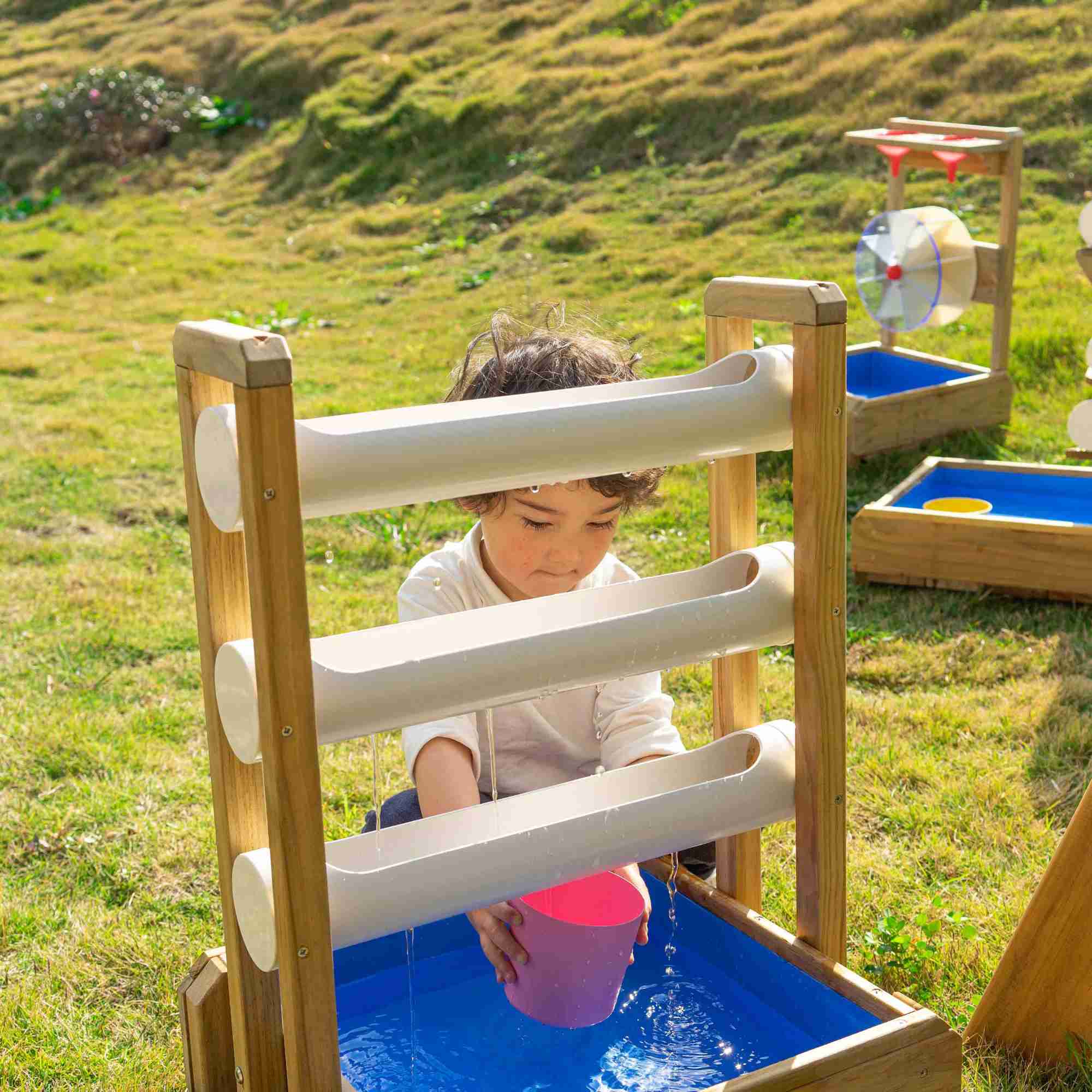 Child Playing with the Happy Water Drip