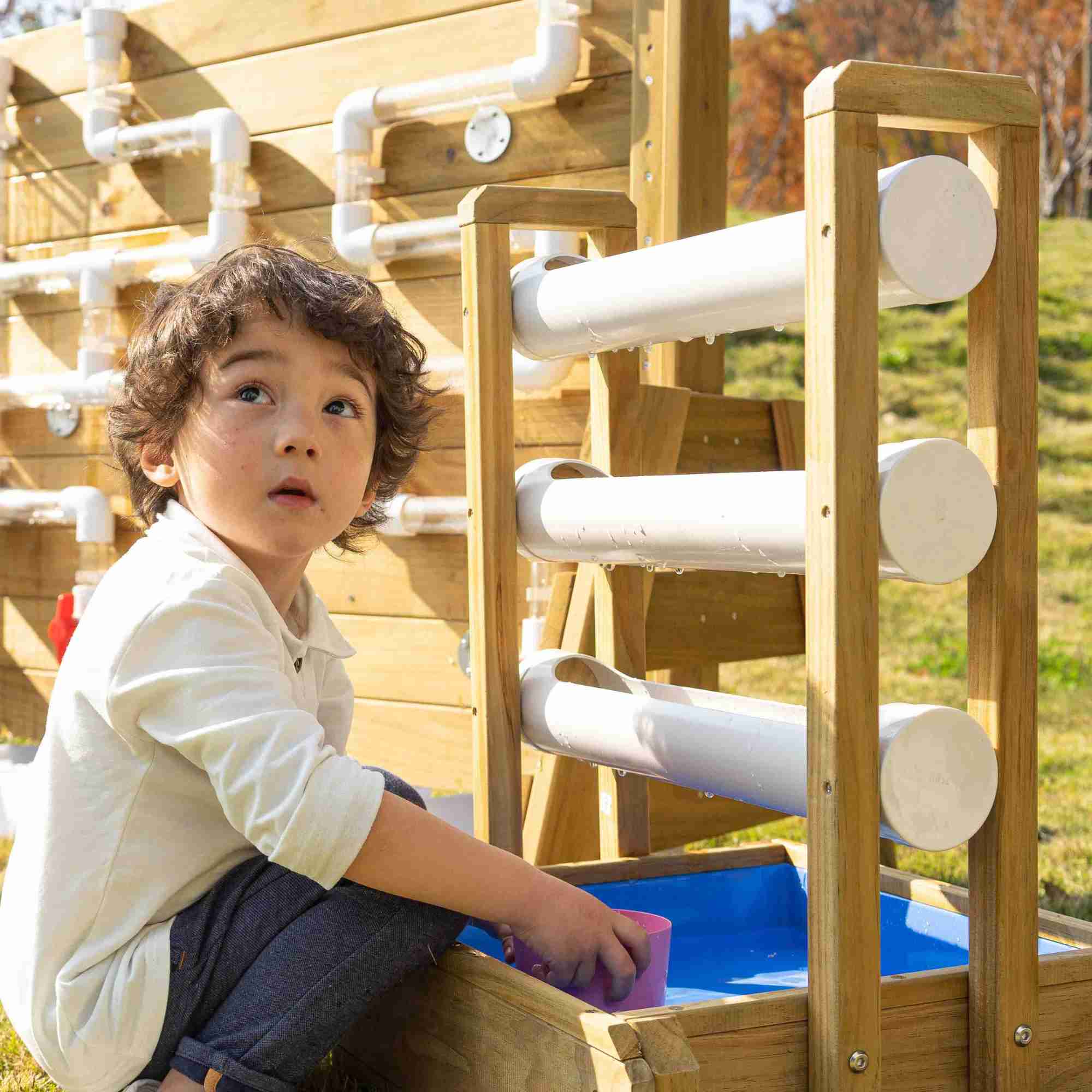 Child Playing with the Happy Water Drip