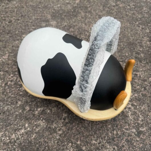 Ex-Display Wheely Bug Cow with bubble wrap on handle