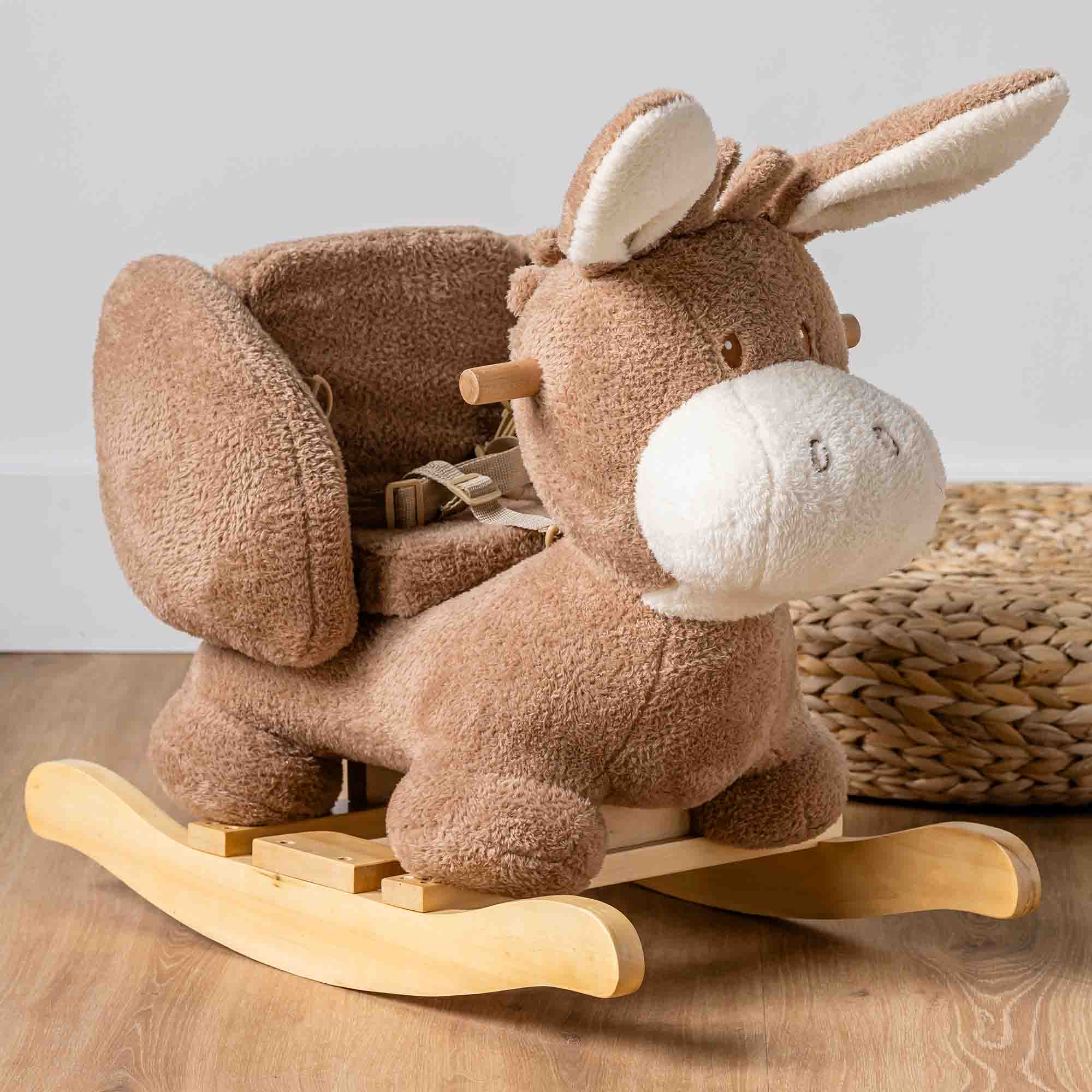 Nattou Teddy Donkey Rocker on a wooden floor