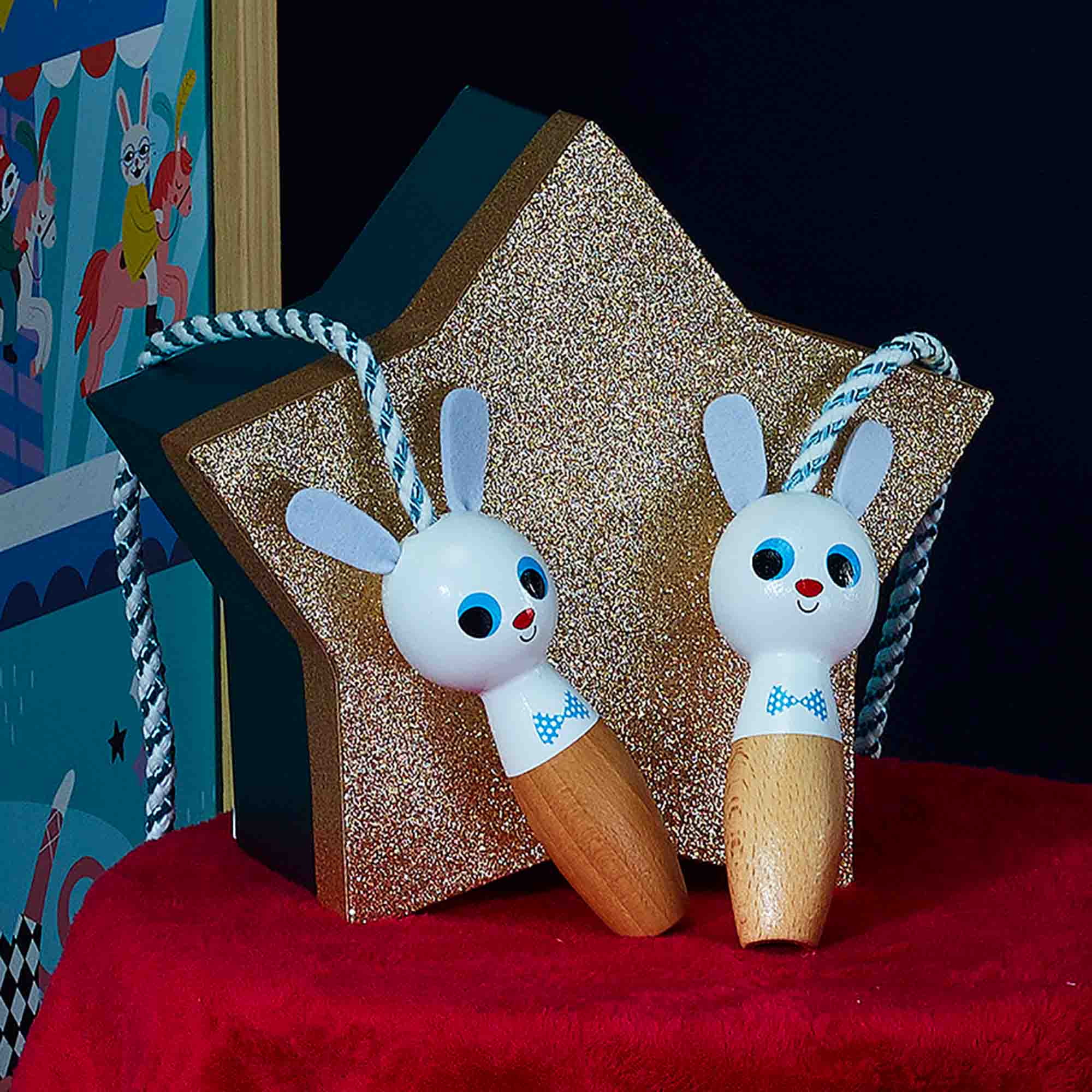 Vilac Skipping Rope against a star and on a red velvet blanket