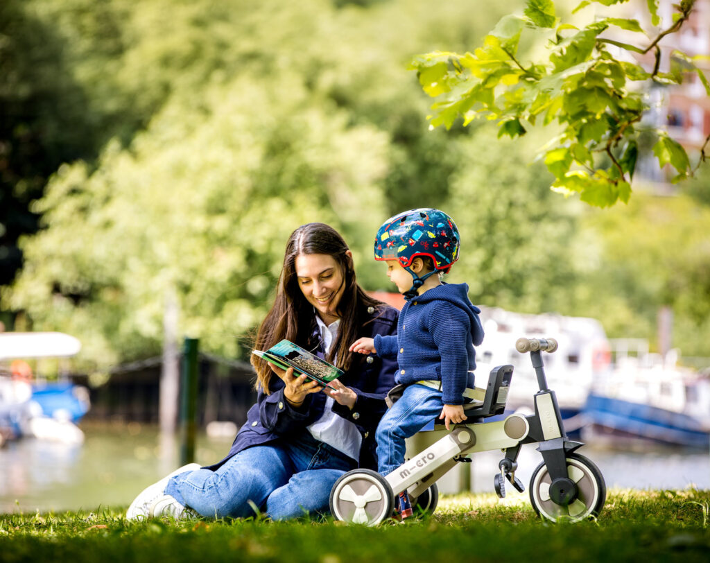 toddler at park with micro scooter trike