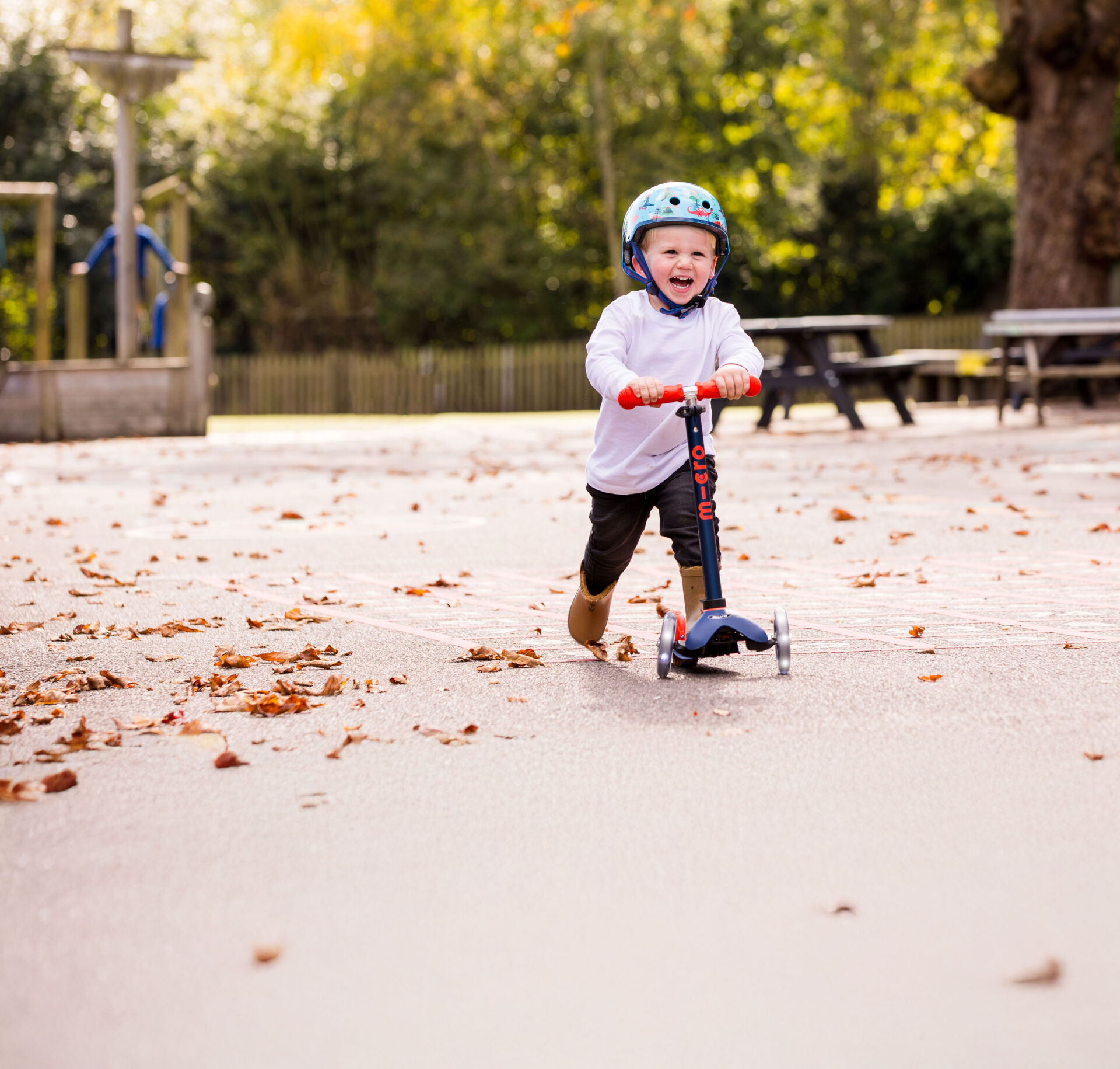 toddler scooting through playground
